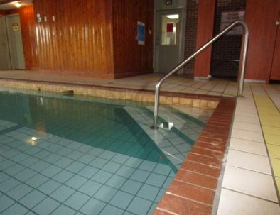 hotel pool showing steps to get in